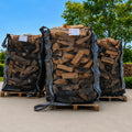 Big bags de bûches de bois de chauffage sur palette